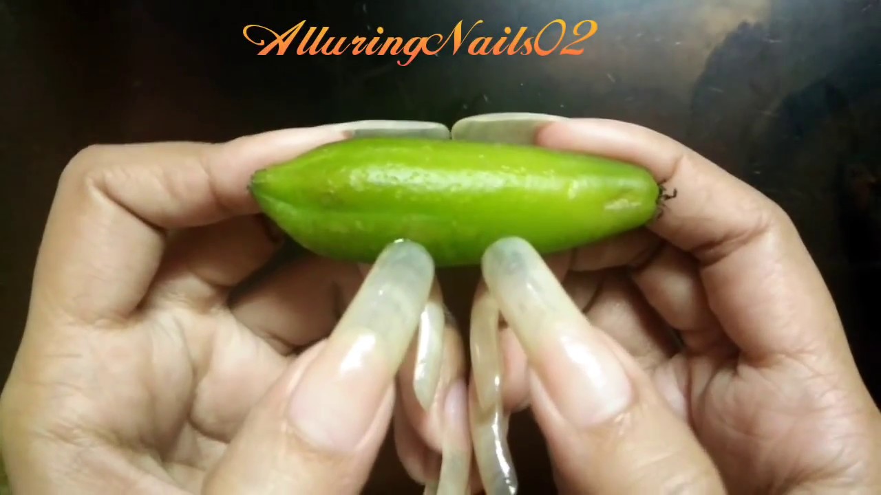 AlluringNails02 testing the strength of her natural long nails (video 3)
