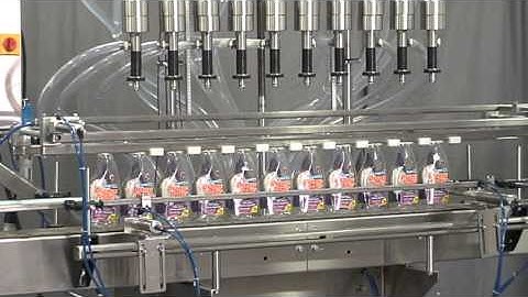 Overflow filler with bottom up filling system, manufactured by Acasi Machinery, 1