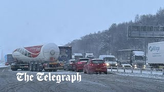 video: UK weather: Police blame motorists for M62 gridlock as drivers stranded by snow for 10 hours