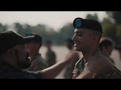 “First Patch” captures the triumphant moment of Soldiers receiving their first patch, evoking feelings of pride from their families and for their career ahead.