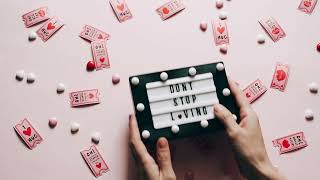 A heartfelt flat lay featuring love tokens and a message board for Valentine's Day.
