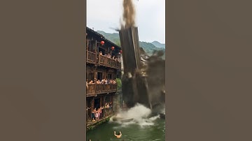 TERRIFYING Moment: Building COLLAPSES into River Packed with Swimmers!