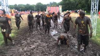 Watch many muddy people dance, flop and slide to Warrior Dash finish line screenshot 4