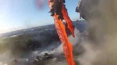 [ amazing up close footage of lava entering the ocean]