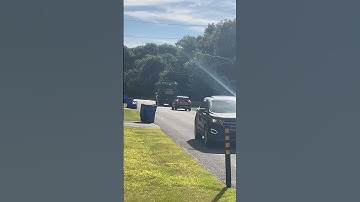 A noisy peterbuilt 548 Labrie automizer on recycling