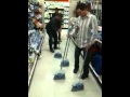 8 brooms stood up at Target