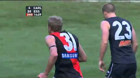 Dustin Fletcher kicks a goal from the centre square
