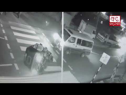 CCTV: Two injured after three-wheeler topples in collision