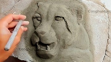 Handmade leopard head embossed on wall with bamboo shoots