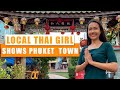 A local Thai girl shows Phuket Old Town. Thailand 2021.