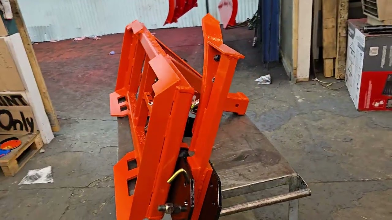 Minnesota Implement trailer plate with trench tool and hook arm accessories