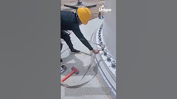 Construction worker installing a wind turbine: wind turbine tutorial