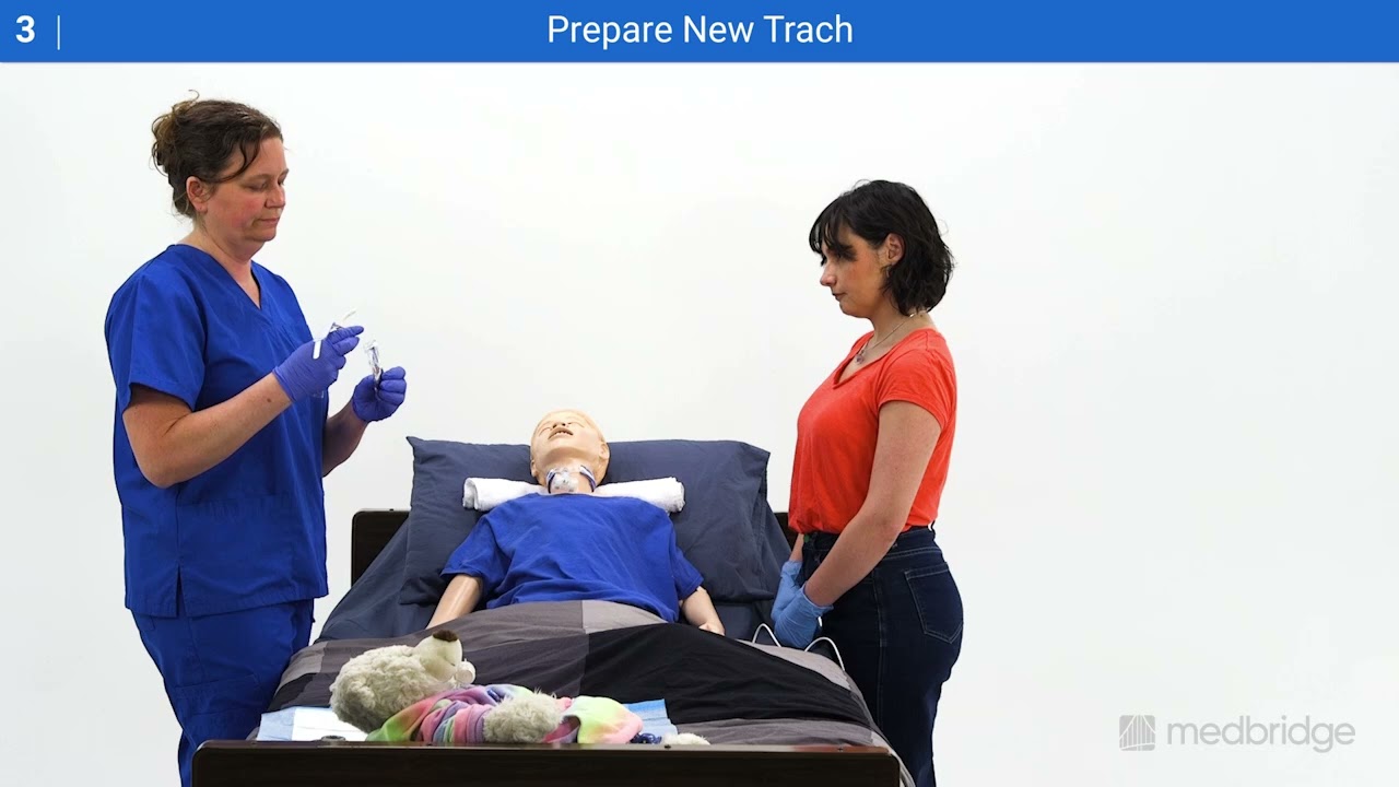 A healthcare worker and student perform tracheostomy training on a mannequin for Medbridge, featuring “Prepare New Trach” text.
