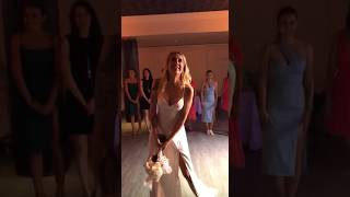the bride throws her wedding bouquet