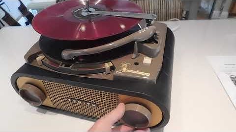 Zenith Stroboscope Cobra-Matic record player playing a couple 33.3 RPM LP records.