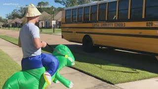 Big brother greets his sibling's school bus in a different costume every day