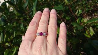 A traditional three stone ruby and diamond ring