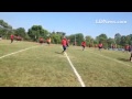 Lebanon High football team getting ready for drills, as coach Gerry Yonchiuk shows off his hat that