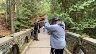 Hat Juggling on a Bridge over a waterfall.