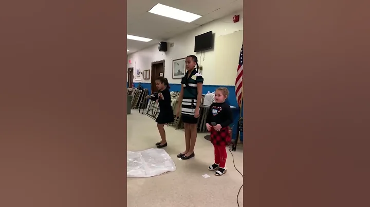 The girl singing for a group of Christian women at a luncheon.