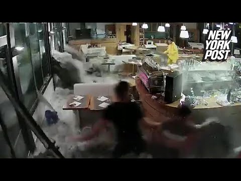 Idiotic restaurant workers tried to stop 20-foot wave with their bare hands