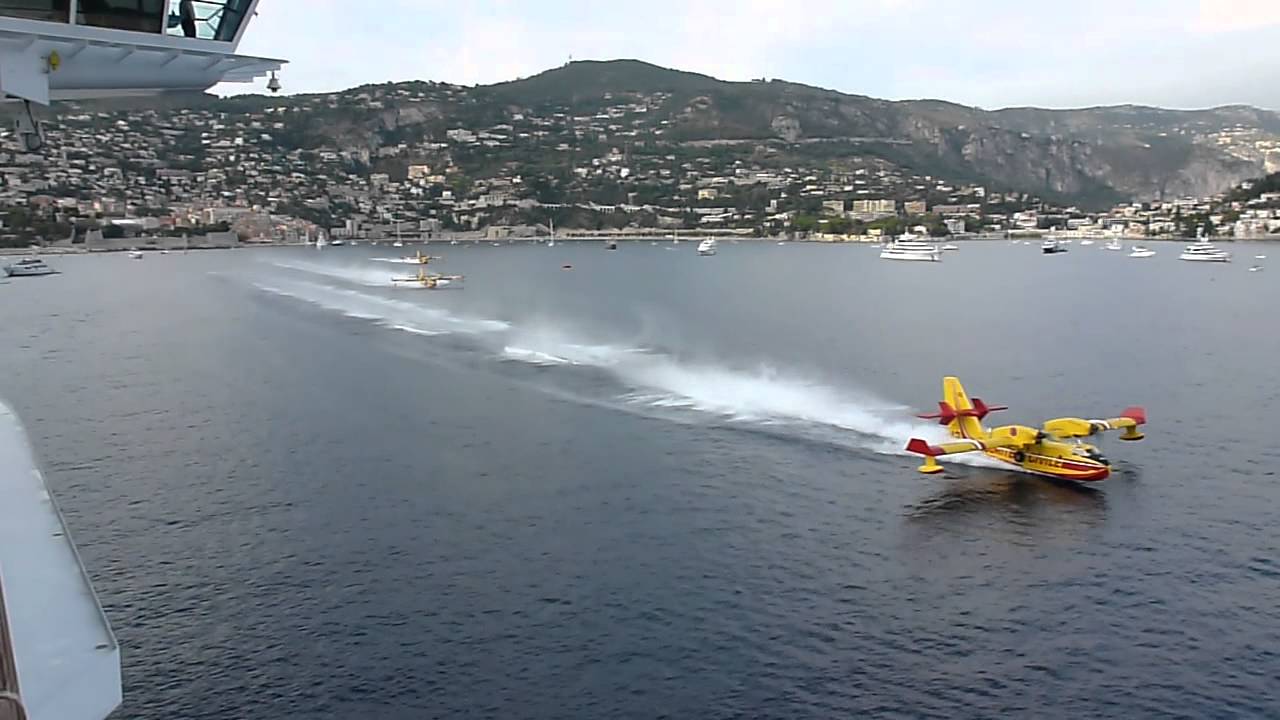 Water Bombers Load Up Next To Cruise Liner