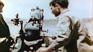 United States soldiers fire a 75mm pack howitzer at a field in Saipan, Pacific. HD Stock Footage