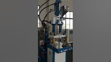 Testing vertical injection molding machine