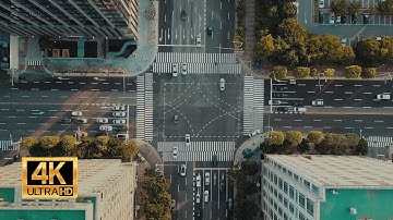 Traffic On An Intersection Road In A City - Drone Footage