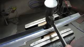 Point of view, quick demo showing hammer forming over a wooden form in the vise