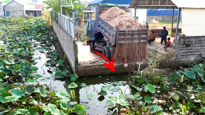 First start opening new project landfill by bulldozer 41P work push soil and dump truck unloading 