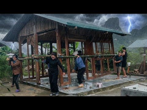 During the storm: Mai and her neighbors struggled to move their wooden house quickly.