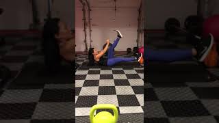 flutter kick dumbbell toe touch