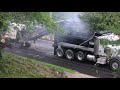 Milling asphalt  off the street  so it can be repaved.