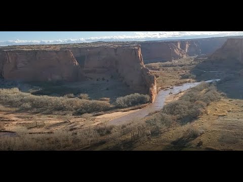 Multiple water crossings with jeep travel by native Indian in Canyon De Chelly National Monument