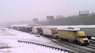 Traffic crawls on I_80-94 eastbound amid whiteout