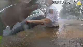 Bodycam shows Atlanta officer, fireman rescue man trapped in car on flooded street