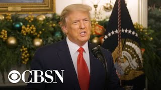 Trump threatens to reject stimulus deal and issues controversial pardons