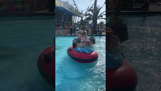 Girl spins repeatedly on boat ride at amusement park and starts to cry