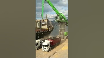Unloading Cargo Ship with Excavator Crane
