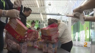City Harvest volunteers package food for families in need