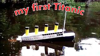 Titanic model out of paper. Model Titanic sinking in the pond.