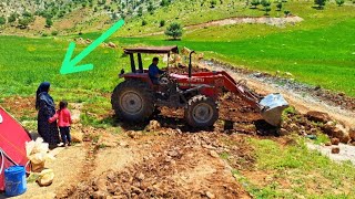 The operator's help to the nomadic family in getting a tractor to level the place of residence