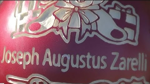 People pay respects and honor Joseph August Zarelli at cemetery