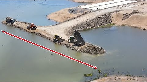 Powerful Construction Equipment Build Road on Water , Dozer SHANTUI Push Stone & 25 Ton Truck Unload