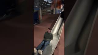 Andy sliding down the world’s greatest slide at Boston City Hall Plaza Playground