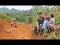 Husband and wifestart digging the foundation to build a new house farm life