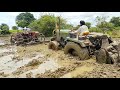 John Deere tractor stuck in mud pulling out by Mahindra #tractor videos #vskveeresh..