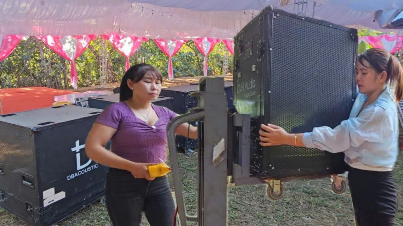 The girl went to help her neighbor transport speakers for the wedding.