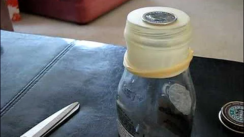 magic trick how to put a coin through a balloon